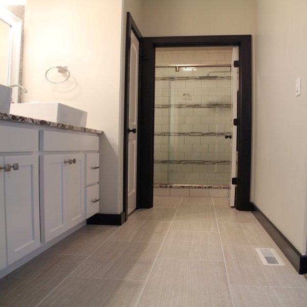 Recent bathroom floor installtion project with white grey tile